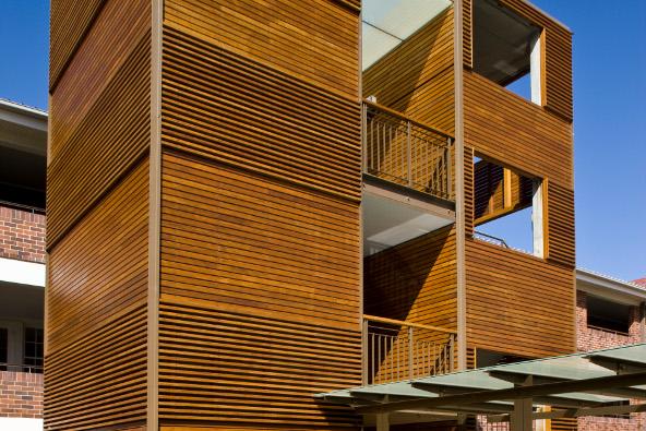 a wood building with a balcony
