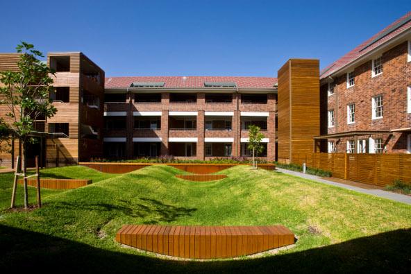 a building with a lawn and a park
