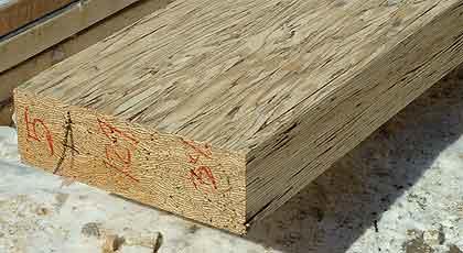 a piece of wood with red writing on it