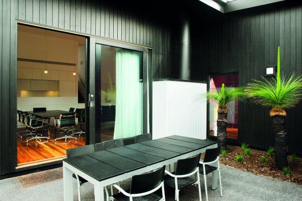 a table and chairs outside of a building