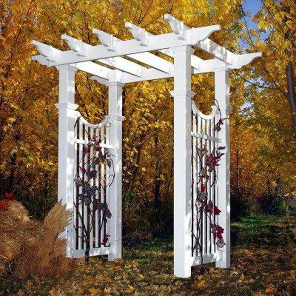 a white arbor with vines on it