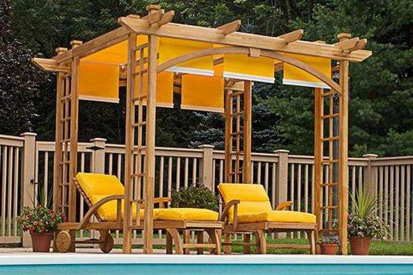 a wooden structure with yellow cushions