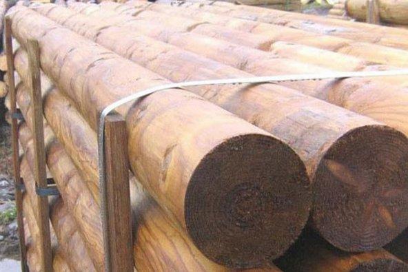 a stack of logs on a rack