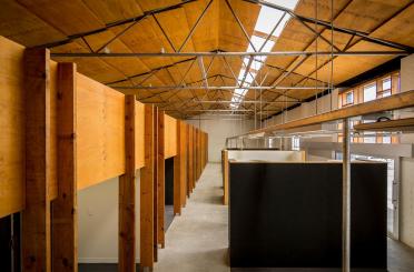 a room with cubicles and a ceiling