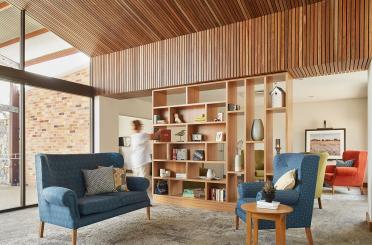 a room with a blue couch and a blue chair