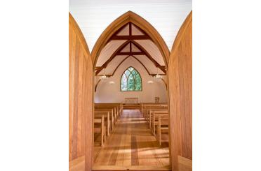a church with wooden floor and wooden ceiling