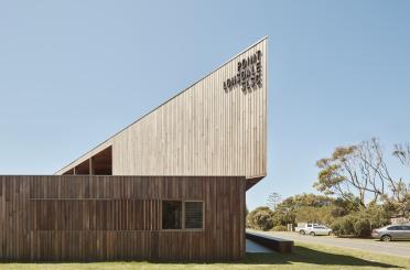 a building with a triangular shaped roof