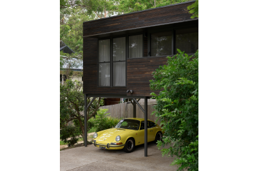 a yellow car parked in a driveway