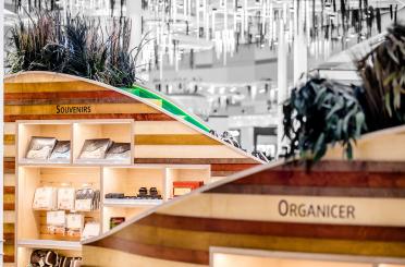 a display of a store with shelves and plants