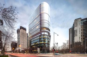 a tall building with glass windows