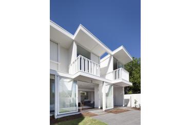a white house with a balcony