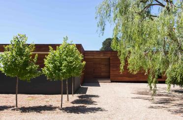 a building with trees in the front