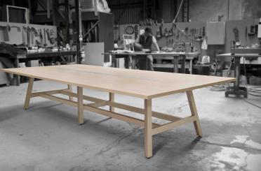 a large wooden table in a workshop