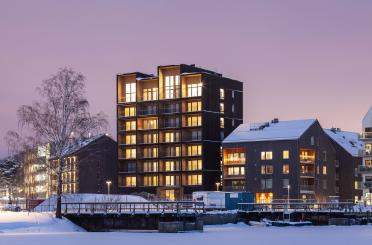 a building next to a body of water