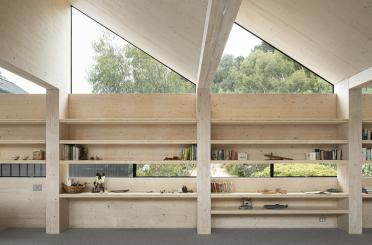 a room with a roof and shelves