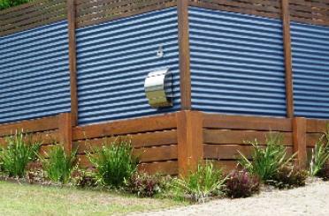 a blue corrugated metal wall