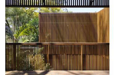 a wood wall with a railing