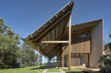 a building with a roof over a porch