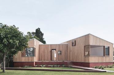 a house with a lawn and trees