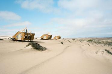 a group of houses in the desert