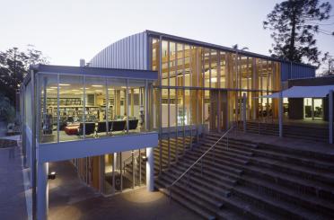 a building with stairs and glass walls