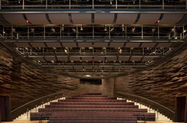 a large auditorium with seats and stairs