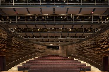 a large auditorium with seats and stairs