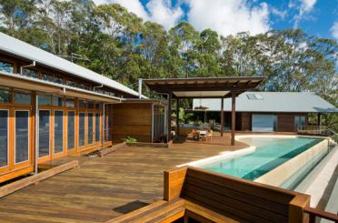 a house with a pool and a deck
