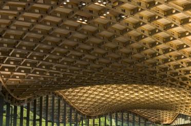 a wooden ceiling with a curved roof