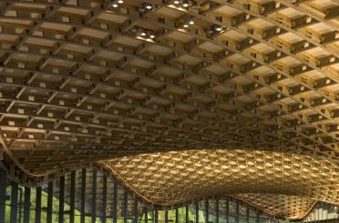 a wooden ceiling with a curved roof