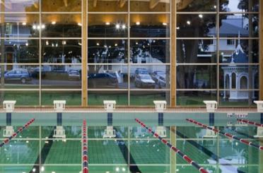 a indoor swimming pool with a large window